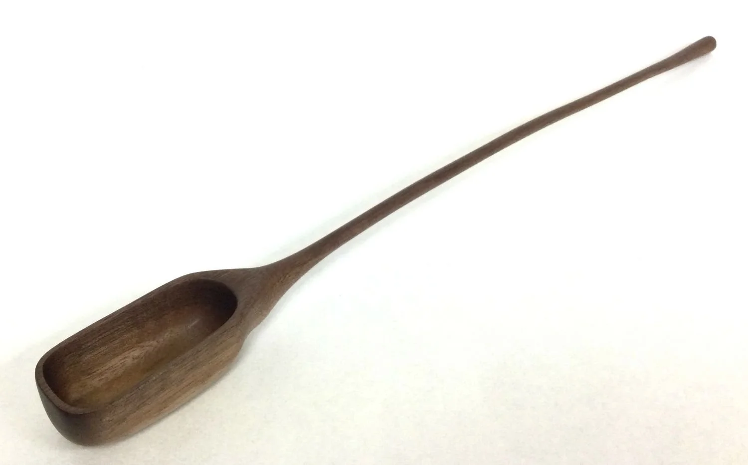 X-Large Deep Bowl - Long Handled Spoon (#25.12.32), 2025, chiseled and hand sanded walnut, 15 x 1.25 x 1 inches (38 x 3.5 x 2.5 cm), $149 Cdn.