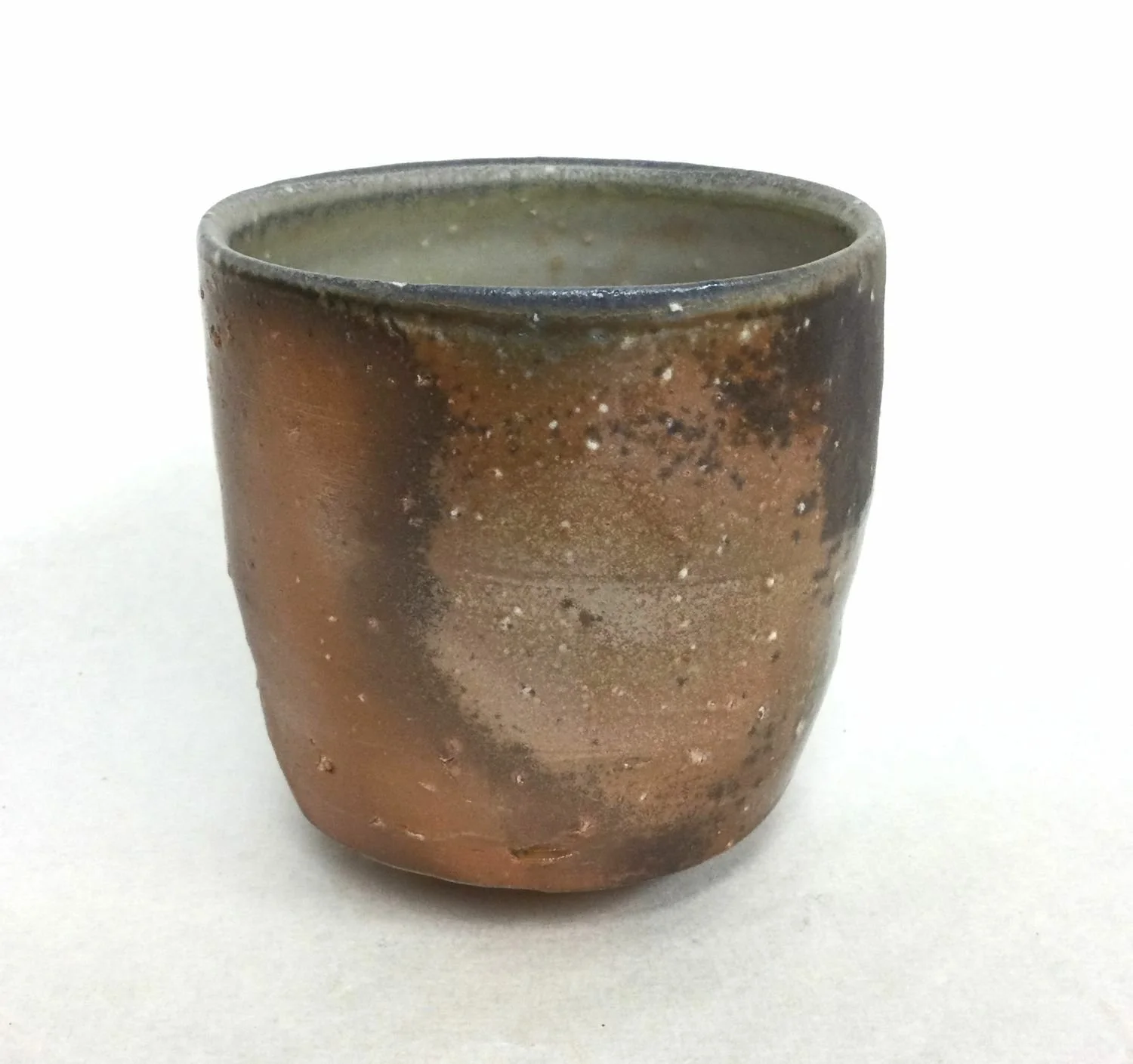 Atmospheric Fired Yunomi Cup With Turned Foot (#25.6), 2025, woodfired porcelain, style of Japanese teacup for daily tea drinking, reduction cooled stoneware, without a handle, 4 x 3.5 inches (10 x 9 cm) $70 Cdn.
