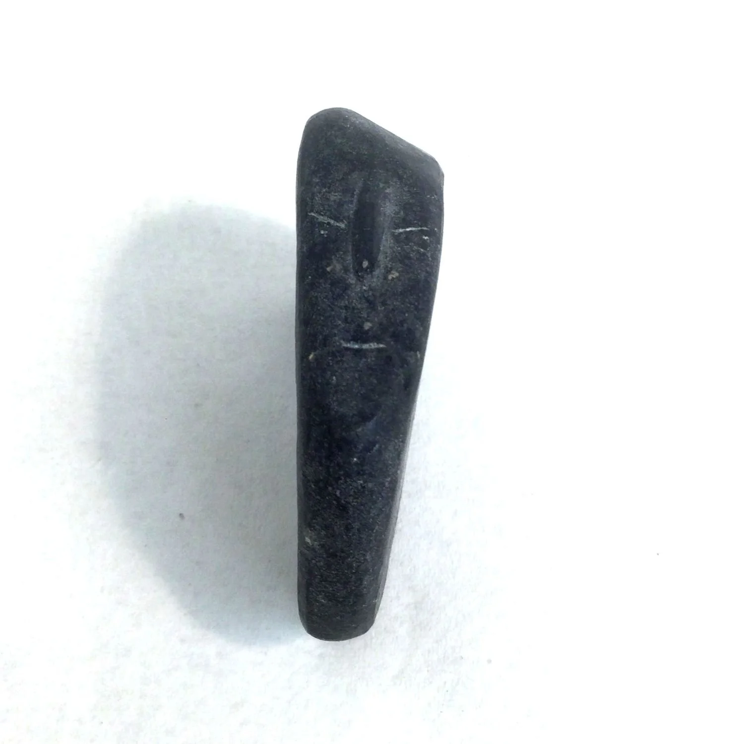 John Pangnark (ᔭᓐ ᐸᓇ) E1-104, 1920-80 Arviat/Eskimo Point ᐊᕐᕕᐊᑦ, Reclining Figure, c.1970s, basalt, 2 x 1.5 x .5 inches (5 x 4 x 1.5 cm), $1100 Cdn.