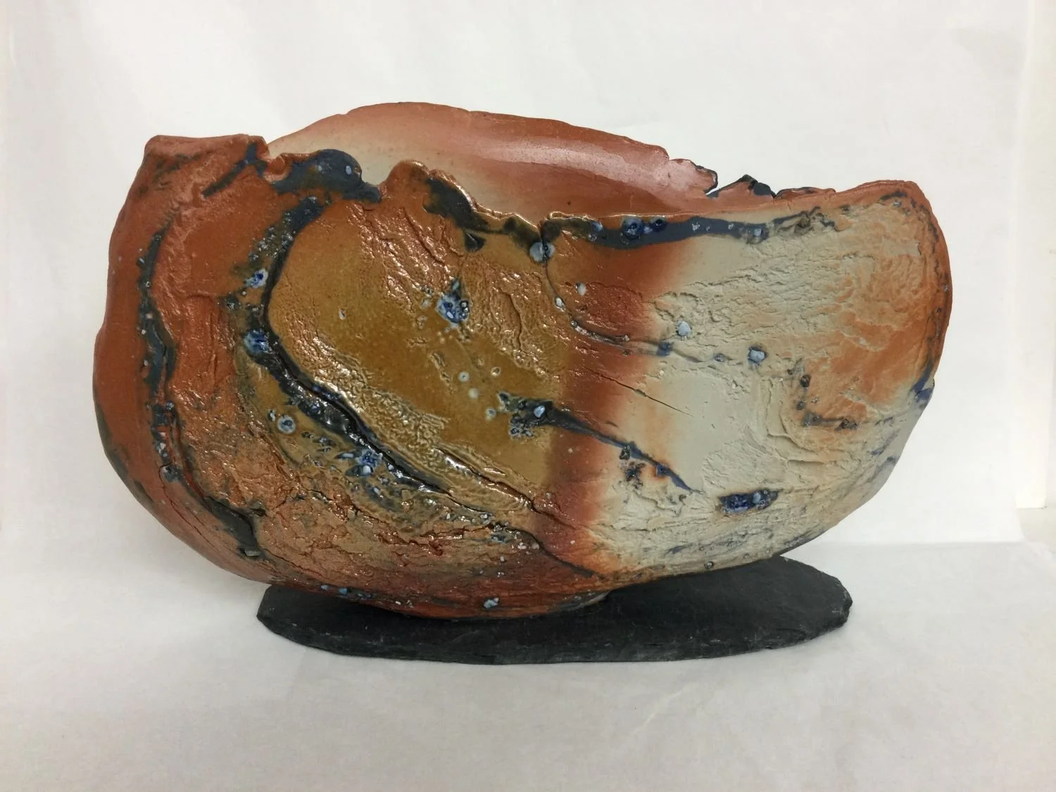 Bowl/Object XXV-IX, porcelain slab with slate base, studded with inclusions of natural materials, wood-fired, 8.75 x 12.5 x 3.5" (22 x 32 x 9 cm), $720 Cdn.