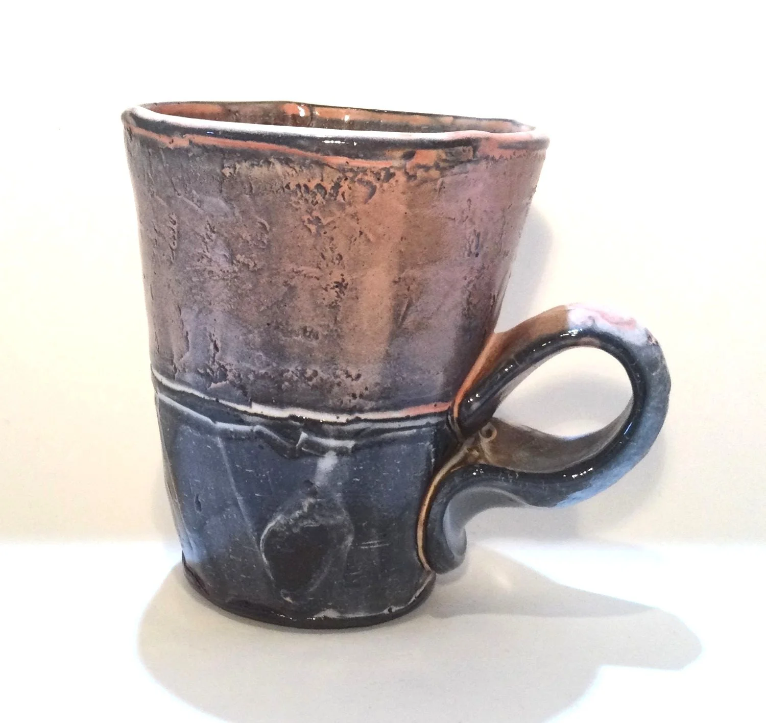 Confluence - Straight Mug (#26.2.62), 2026, low soda-fired earthenware, 4.25 x 4.75 x 3.25 inches (11 x 12 x 9 cm), $85 Cdn.