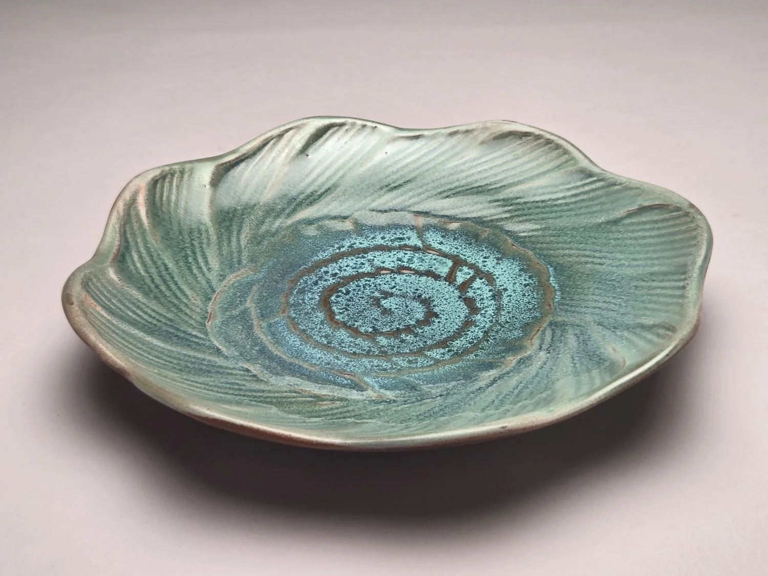 Whirlpool & Blue Sky Plate (#26.5.9b), 2026, glazed stoneware, 1.25 x 9 x 9 inches (3 x 23 x 23 cm), $110 Cdn.