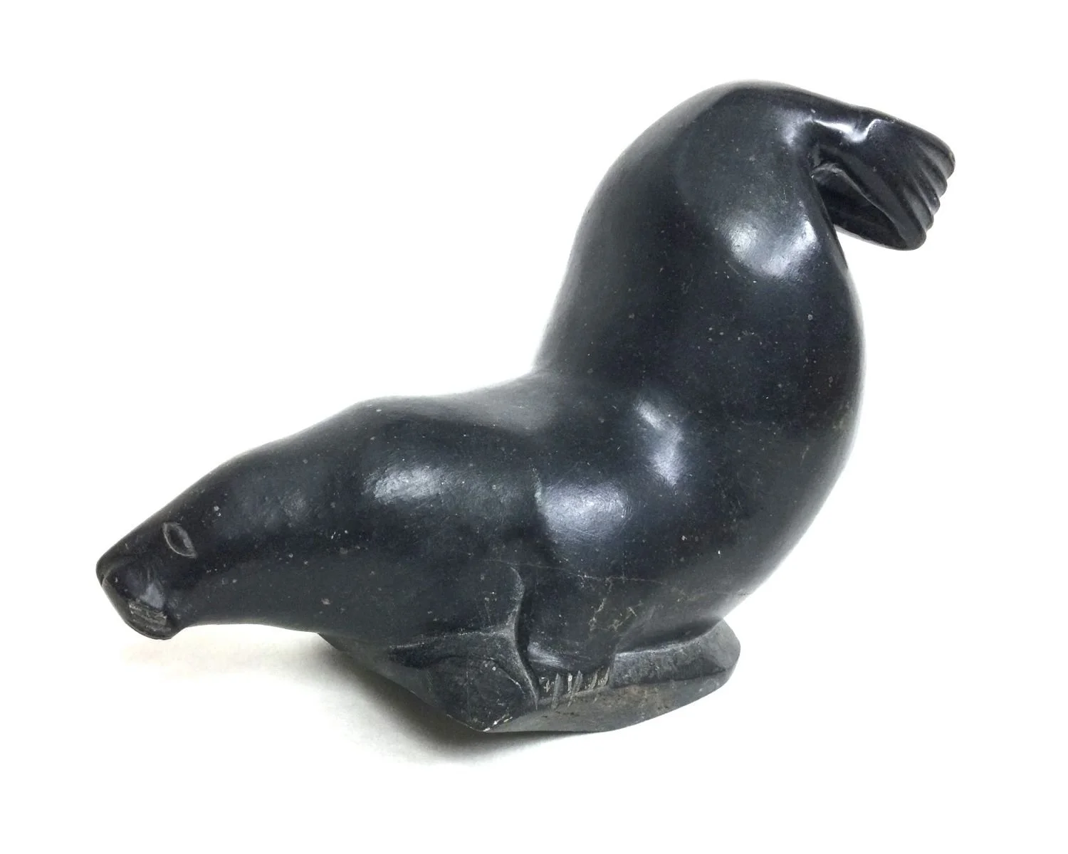 Elijassiapik E9-915 (1912-72) Inukjuak/Port Harrison, ᐃᓄᒃᔪᐊᒃ, Diving Walrus, c.mid-1950s, serpentine, 7 x 4.25 x 10.5 inches (17.75 x 11 x 26.5), provenance: private collection BC, $2500 Cdn.