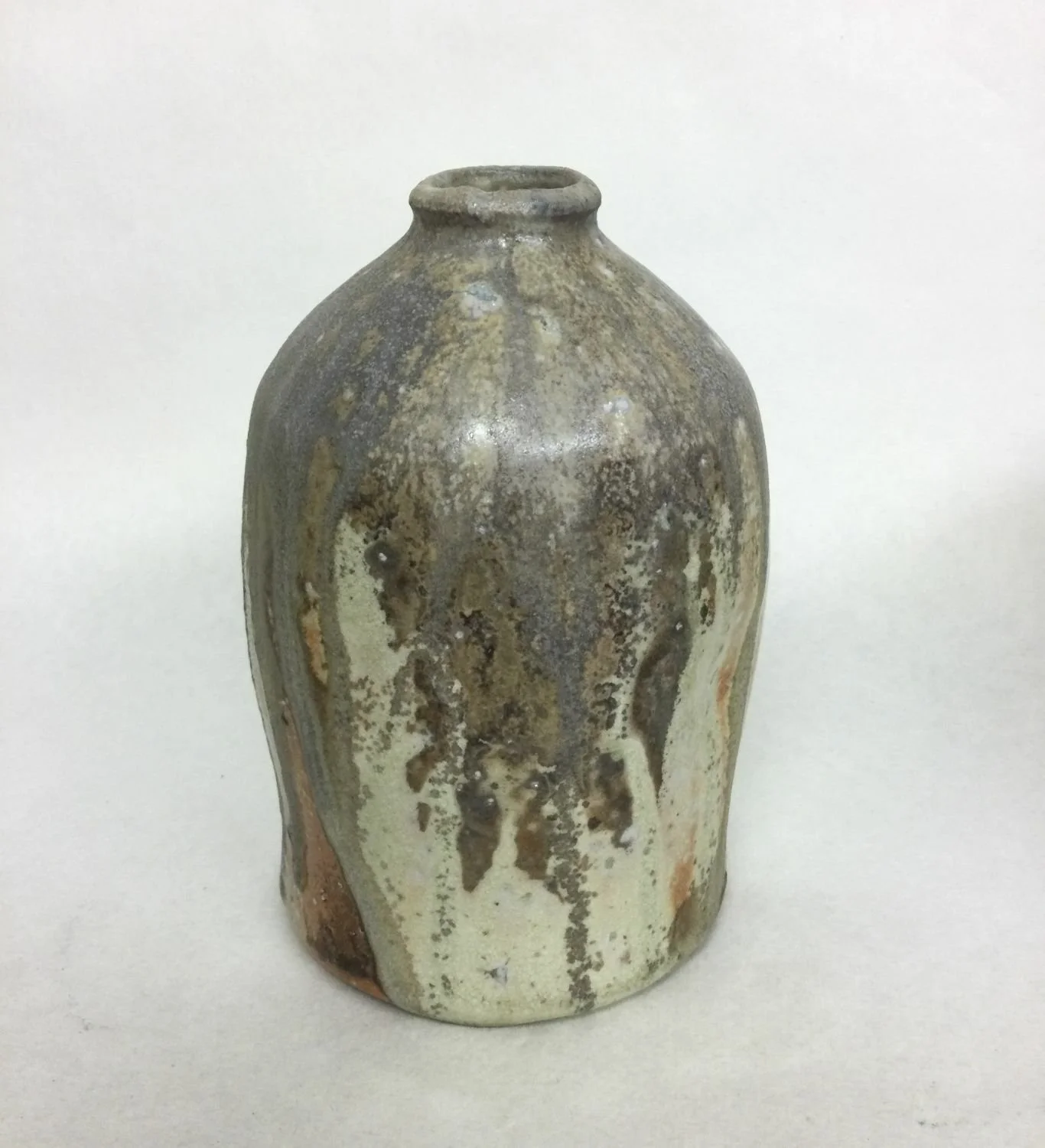 Atmospheric Fired Bottle (#25.14), 2025, woodfired porcelain, 5.5 x 3.5 inches (13.5 x 9 cm) $195 Cdn.