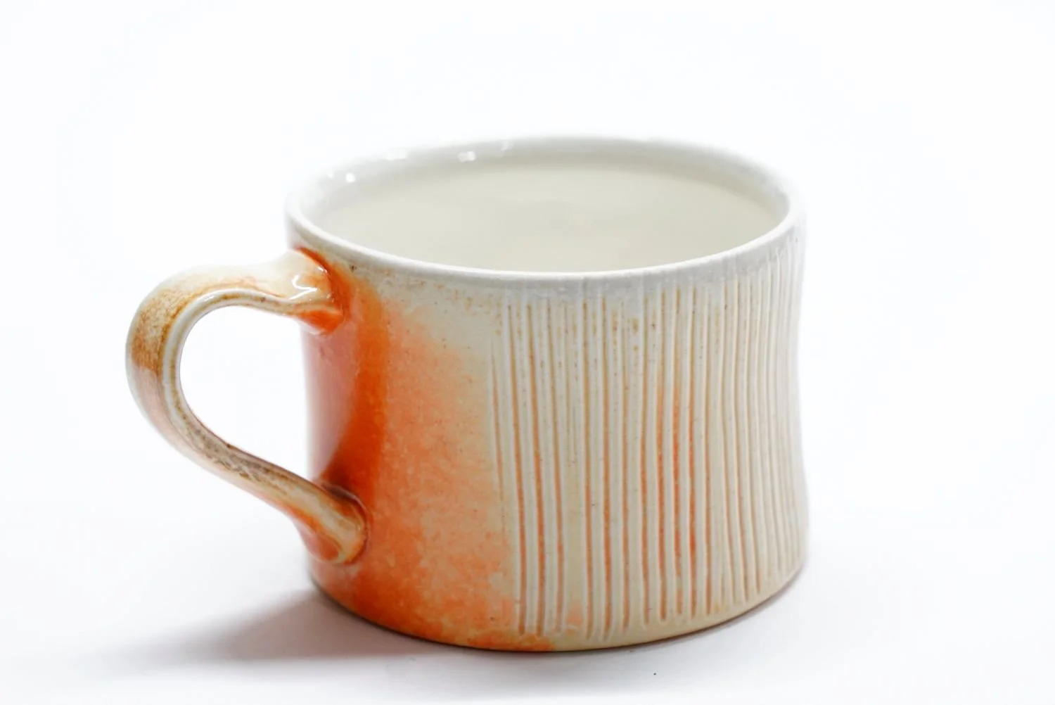 Espresso Cup (#25.70), 2025, soda fired porcelain, 2.25 x 3 x 4" (5.5 x 7.5 x 10 cm) $40 Cdn.
