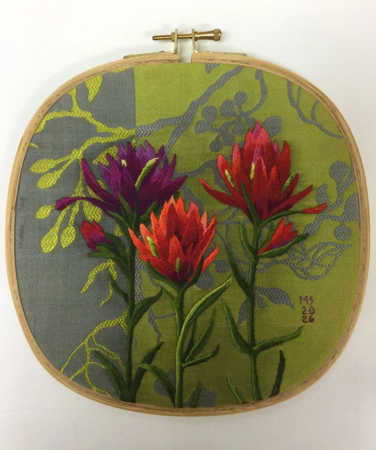 Indian Paintbrush (#26.6.6), 2026, hand embroidery, silk shading on silk ground, framed in oak hoop, 8.5 x 8.25 x .25 inches (21.5 x 21 x .75 cm), $1400 Cdn.
