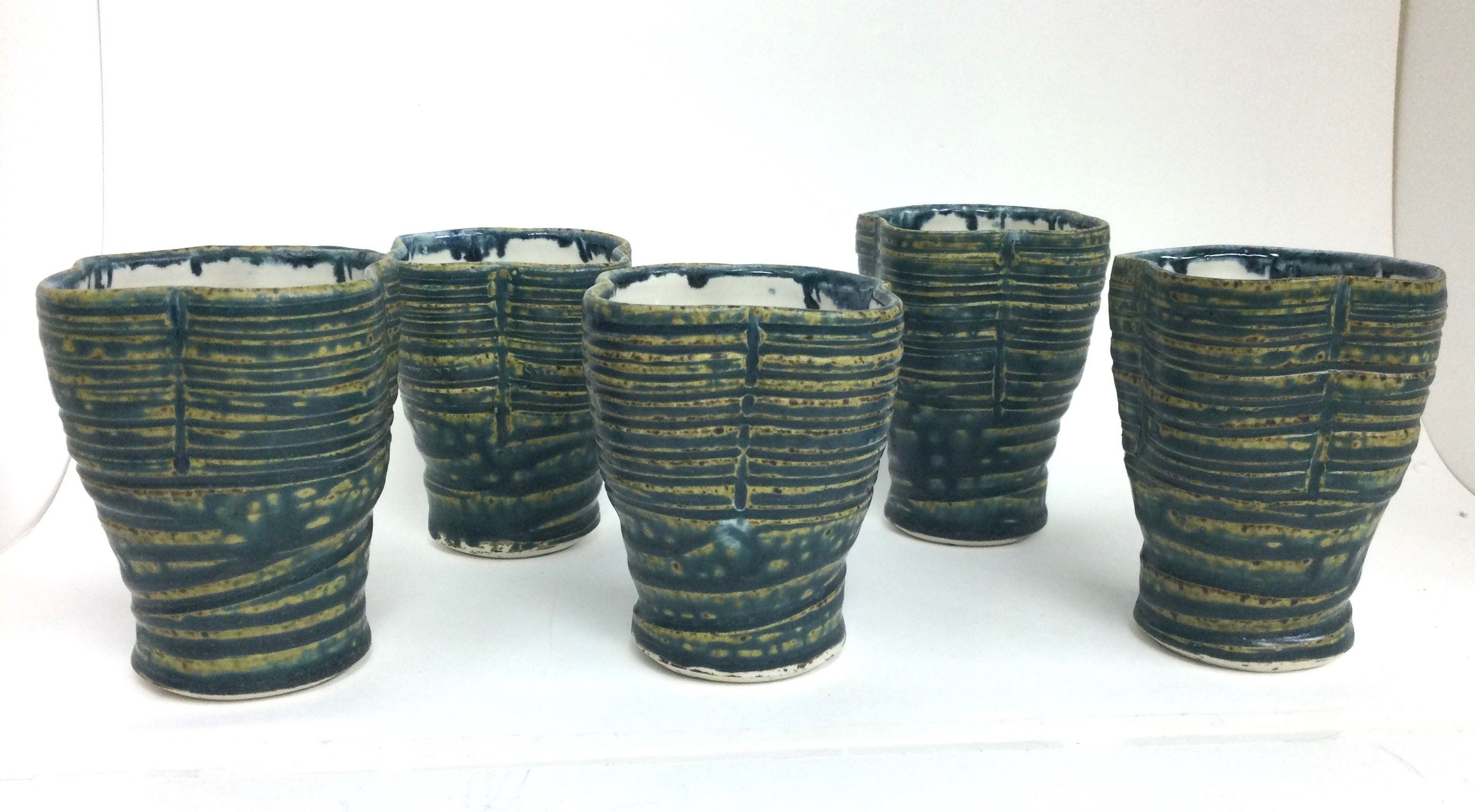 Reduction Shot Glasses (#26.6.32g-k), 2026, reduction fired porcelain, 3.5 x 2.75 inches (9 x 7 cm), $25 Cdn each