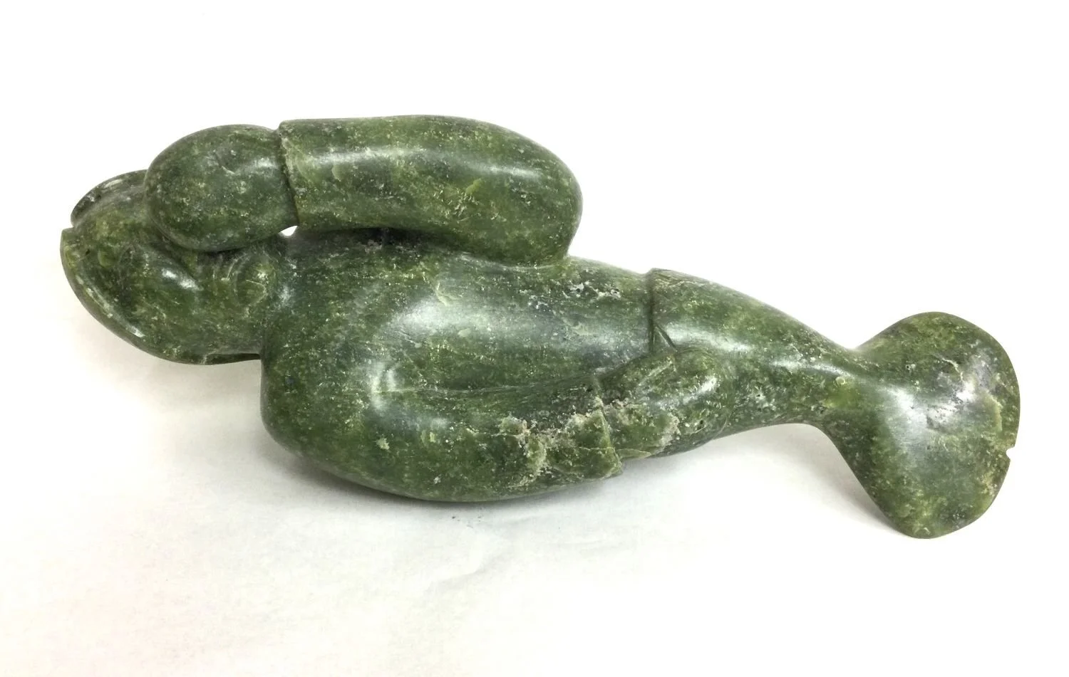 Eyeetsiak Peter, E7-1150 (1937-2011), (Kinngait/Cape Dorset, ᑭᙵᐃᑦ), Taloolayook (Sedna), c.1970, green serpentine, 7 x 5.25 x 20 inches (18 x 13 x 51 cm), provenance: private collection BC, $2700 Cdn.