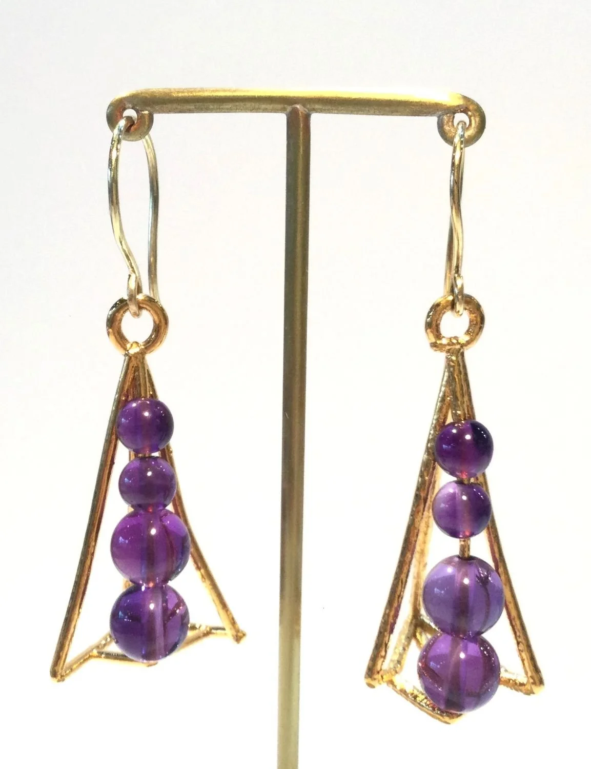 Spine Cage Series Earring (#280), 2017, thick electroformed 24k gold, amethysts, 18k gold ear wire, fusion welded stainless steel, electroformed copper, 2.25 x .75 inches (5.5 x 2 cm), $1400 Cdn.