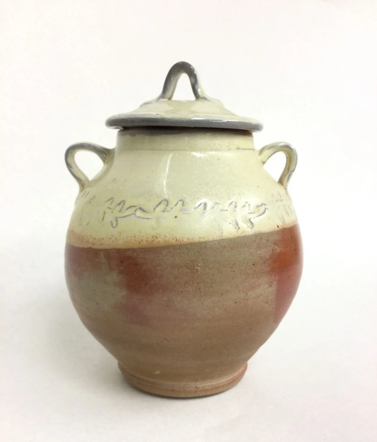 Yellow Lidded Jar (#22.1), impressed & yellow glazed, woodfired porcelain, 7 x 5 inches (18 x 13 cm), $130 Cdn.