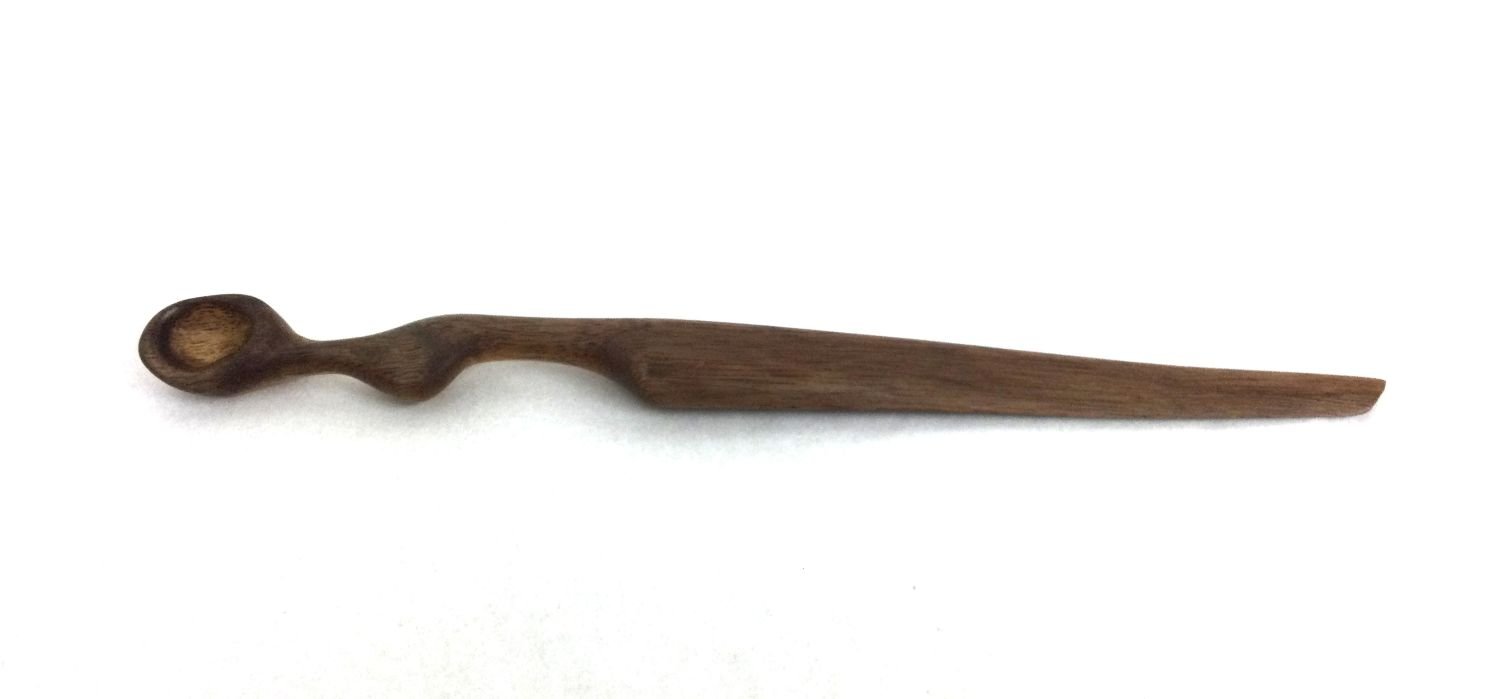 Tasking Spoon And Cheese Knife (#25.2.11), 2025, chiselled and hand sanded walnut, 11 x 1 x .75 inches (28 x 2.5 x 2 cm), $95 Cdn.