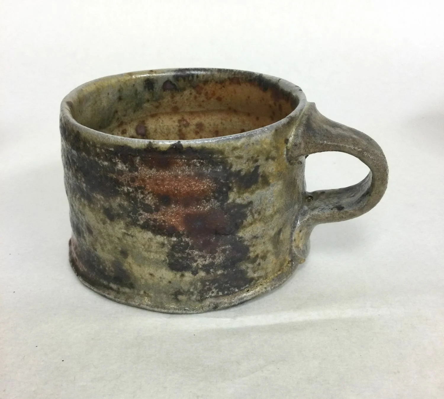 Natural Ash Glazed Mug (#25.3), 2025, woodfired porcelain, 2.5 x 3.5 x 4.25 inches (6 x 9 x 10.5 cm) $75 Cdn.