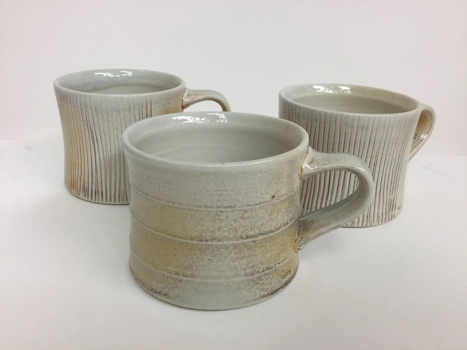 Espresso Mug (#26.7.2B), 2026, soda fired porcelain, 3 x 4.5 x 3.25 inches (7.5 x 11 x 8 cm), $45 Cdn (E&F in background sold)