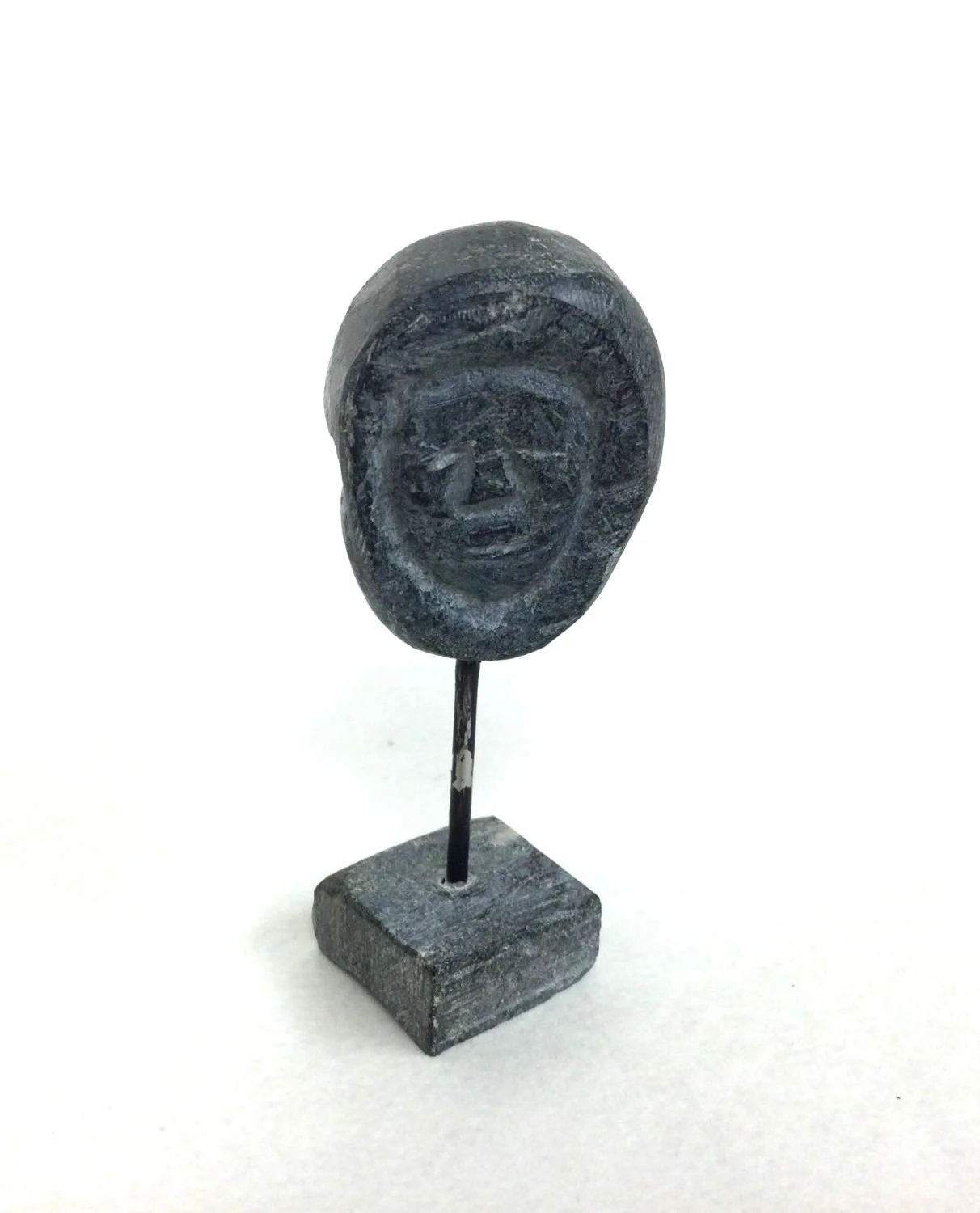 Vital Okoktok E3-204 (1912-unknown), Kangiqliniq/Rankin Inlet ᑲᖏᕿᓂᖅ, Transformation (#25.9.15), c.1970s, steatite (soapstone) with metal support, 3.5 x 1.5 x 1.25 inches (8 x 3.5 x 3 cm), $275 Cdn.