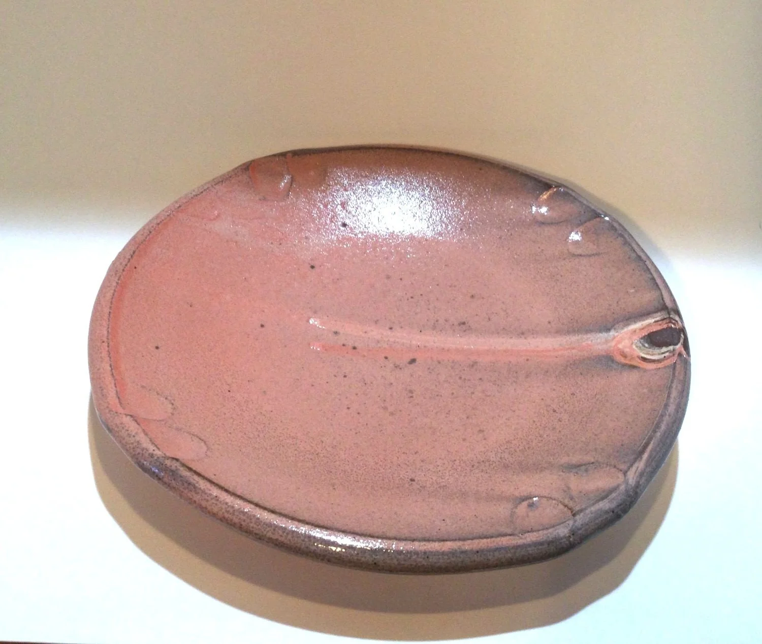 Confluence Side Plate (#26.2.48), 2026, low soda-fired earthenware, 1.25 x 7.5 x 7.5  inches (3 x 19 x 19 cm), $80 Cdn.