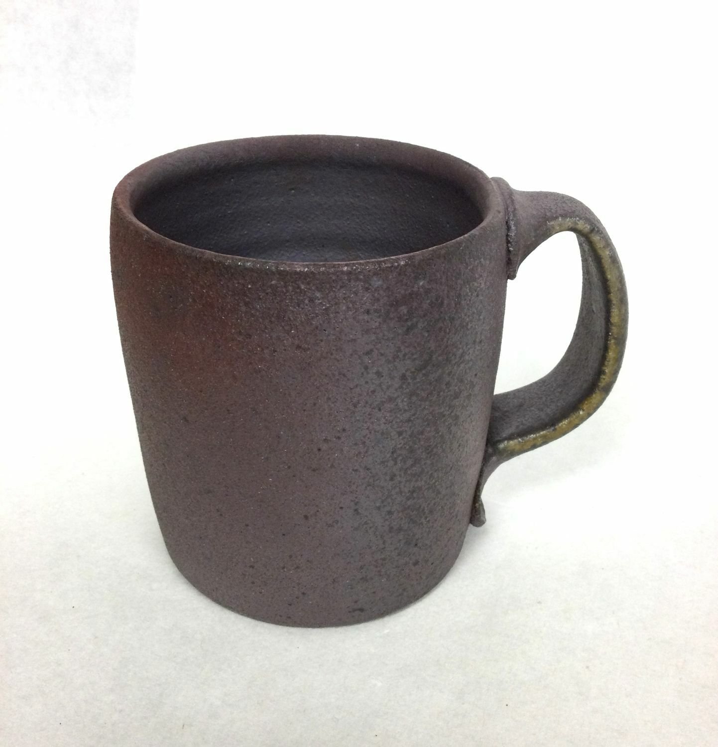 Reduction Cooled Mug (#25.1), 2025, woodfired porcelain, 4 x 3.25 x 4.75 inches (10 x 8.5 x 12 cm), sold.