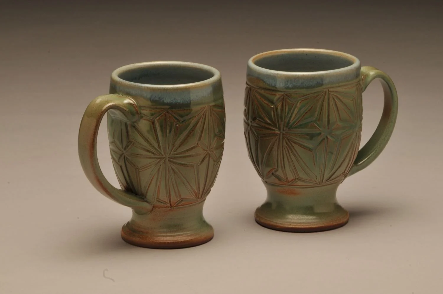 Kumiko Green Fields Mugs (#12, #16), hand carved stoneware, 5 inches (13 cm) high, sold.