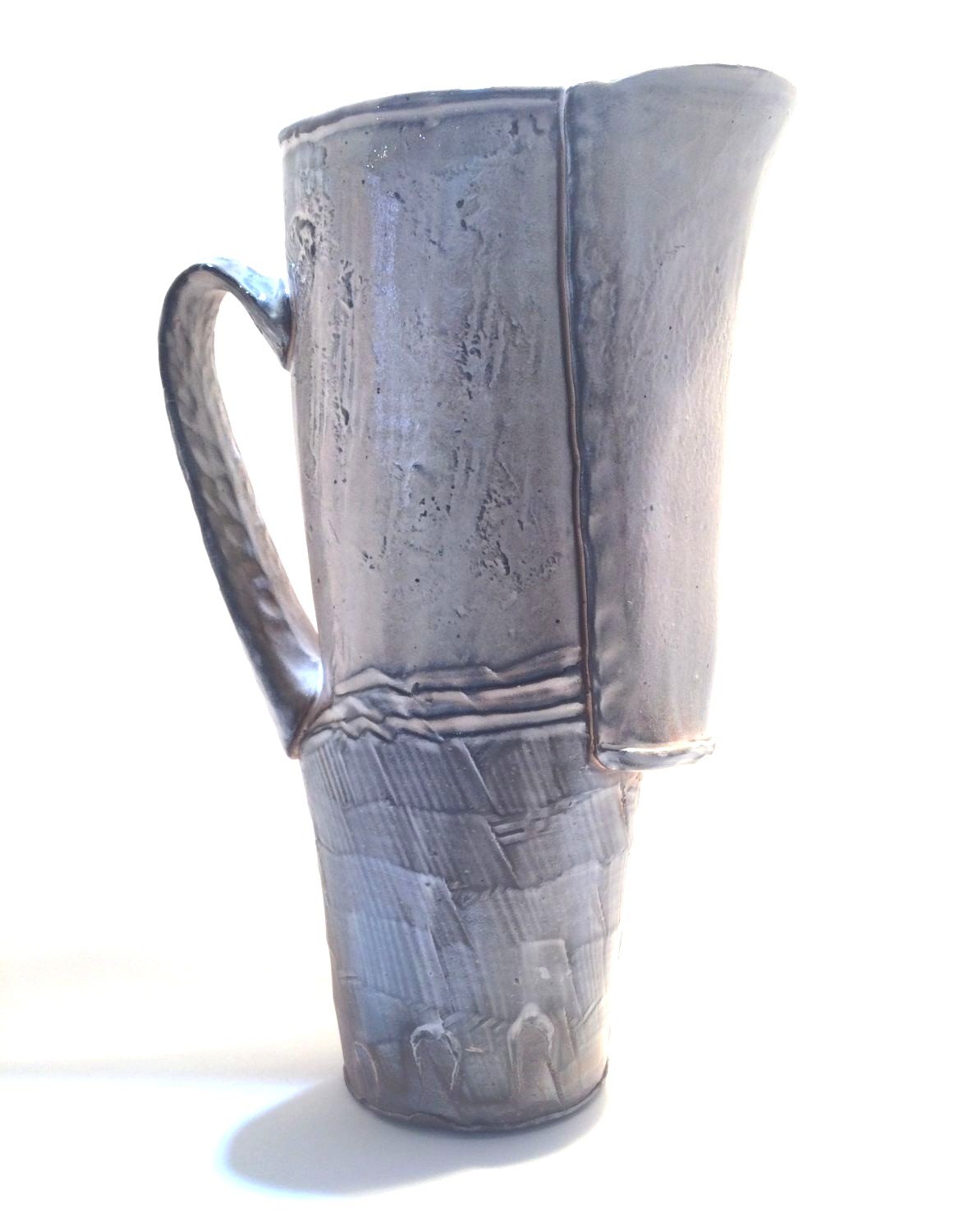 Confluence Pitcher (#26.2.1), 2026, low soda-fired earthenware, 11 x 3.25 x 7.25 inches (28 x 8.5 x 18.5 cm), $280 Cdn.