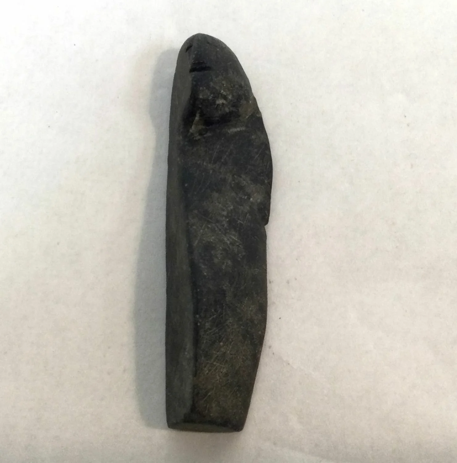 Lucy Tasseor Tutsweetok ᓗᓯ ᑕᓯᐅ ᑎᓯᑕ (1934-2012) Arviat/Eskimo Point ᐊᕐᕕᐊᑦ, Slender Woman, c.1974, basalt, sold.