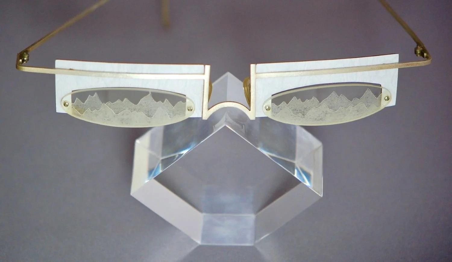 Snow Blind / Snow Glasses (JA130), 2004, sterling, laminate, plastic, c. 5 3/8 x 5 5/8 x 1 1/8 inches (13.7X14.4X3 cm), $750 Cdn.