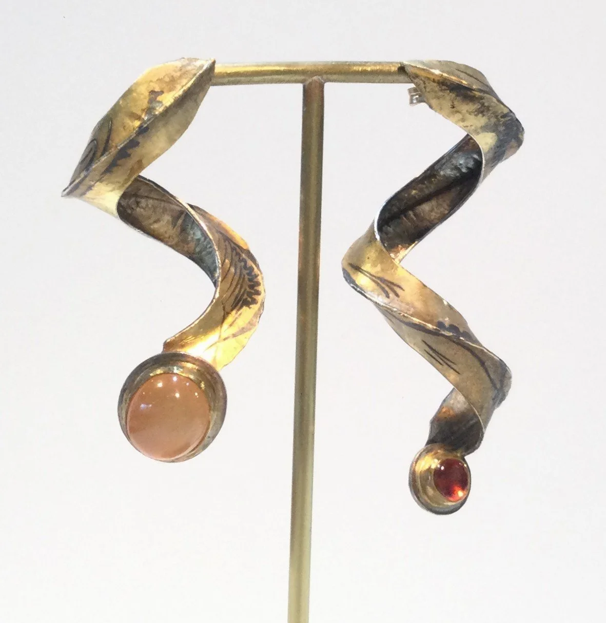 Waterspout Swoop Post Earrings (#281), c.1995, 18k gold, doublee, moonstone, garnet, sterling silver, 1.5 x .5 inches (4 x 2 cm), $2100 Cdn.