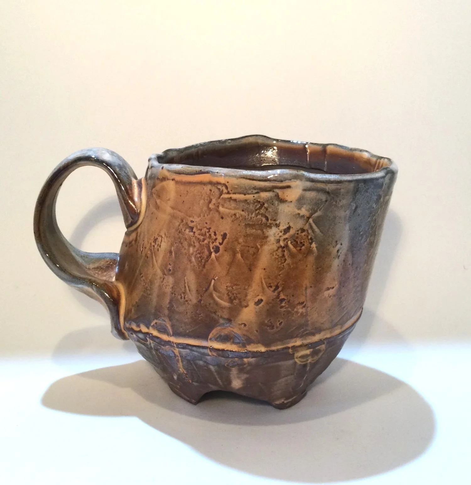 Confluence - Footed Mug (#26.2.88), 2026, low soda-fired earthenware, 3.75 x 5 x 3.5 inches (10 x 13 x 9 cm), $90 Cdn.