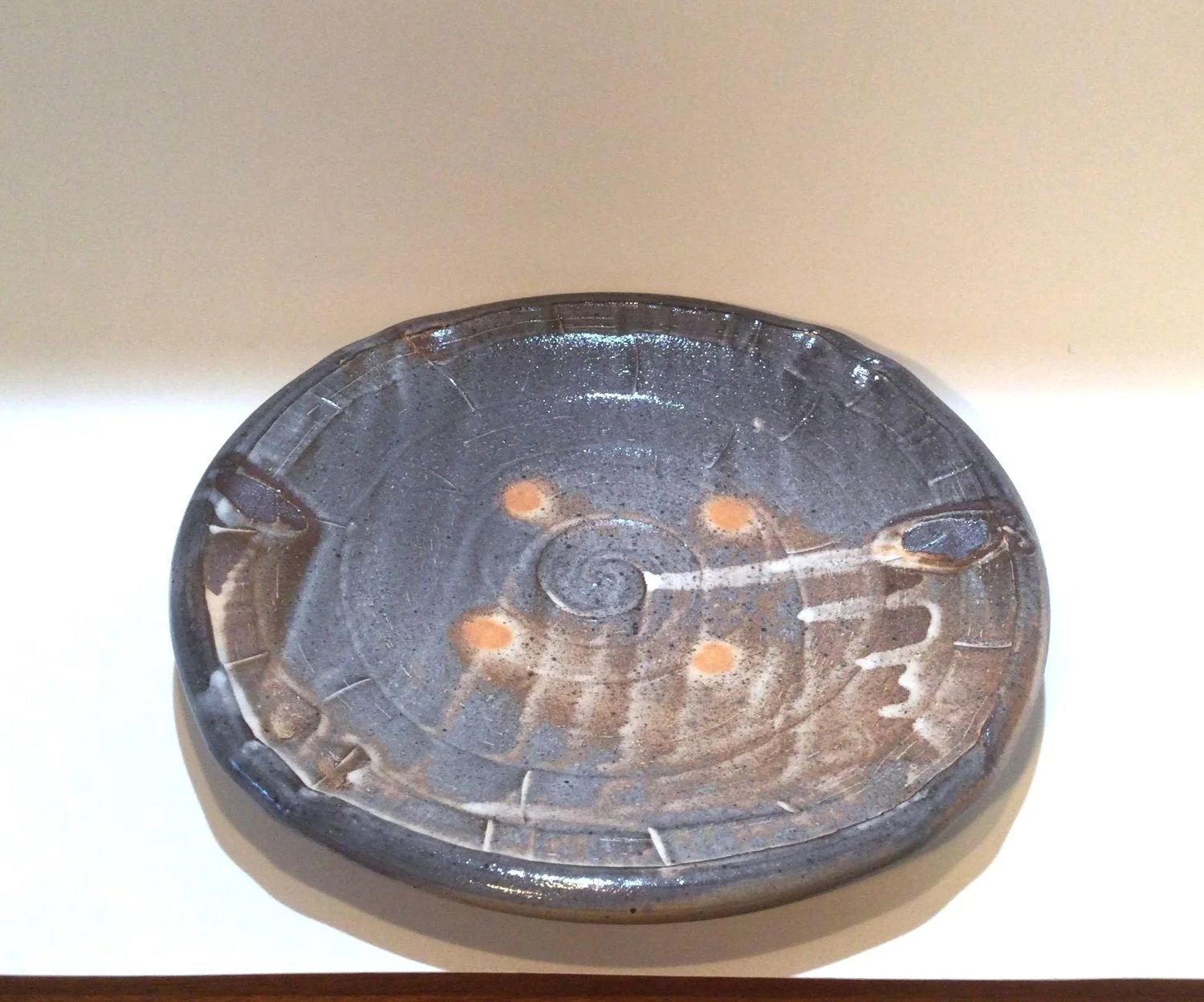 Confluence Side Plate (#26.2.49), 2026, low soda-fired earthenware, 1.25 x 7.5 x 7.5  inches (3 x 19 x 19 cm), $80 Cdn.