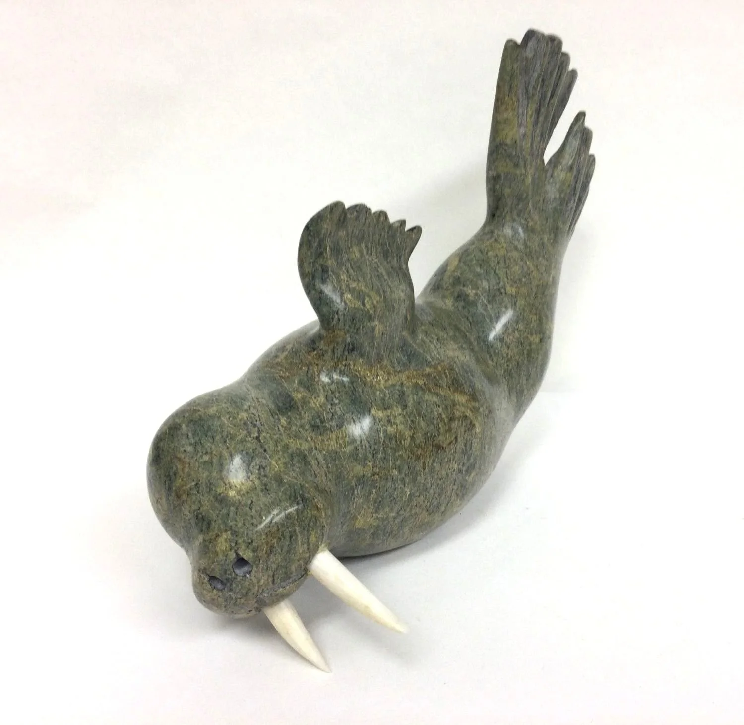 Kingwatsiak Jaw (E7-1970) 1962-2012 (Kinngait/Cape Dorset, ᑭᙵᐃᑦ), Diving Walrus, c.2000, green serpentine & antler, 7 x 11 x 3.5 inches (18 x 28 x 9 cm), $1800 Cdn.