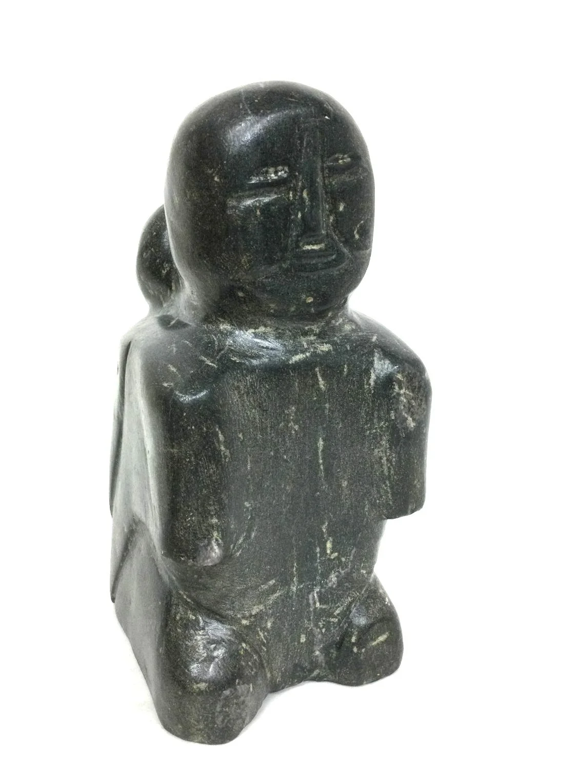 Margaret Uyauperq Aniksak E1, 1907–93 Arviat/Eskimo Point ᐊᕐᕕᐊᑦ , Mother With Child In Amauti, mid 1960s, basalt/serpentine, 10.25 x 6 x 5 inches (26 x 15 x 13 cm), $2975 Cdn.