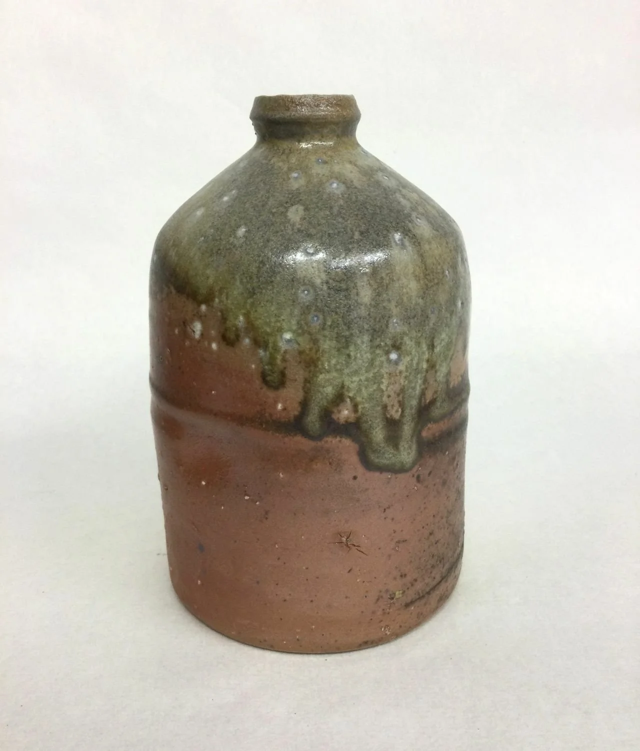 Atmospheric Fired Bottle (#25.13), 2025, woodfired porcelain, 5.75 x 3.5 inches (14.5 x 8.5 cm) $195 Cdn.