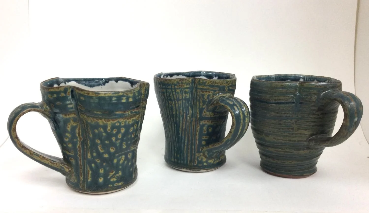 Wavy Reduction Fired Espresso Cups (#26.6.35bcd), 2026, reduction fired porcelain, 3.5 inches (9 cm) high, $35 Cdn each.
