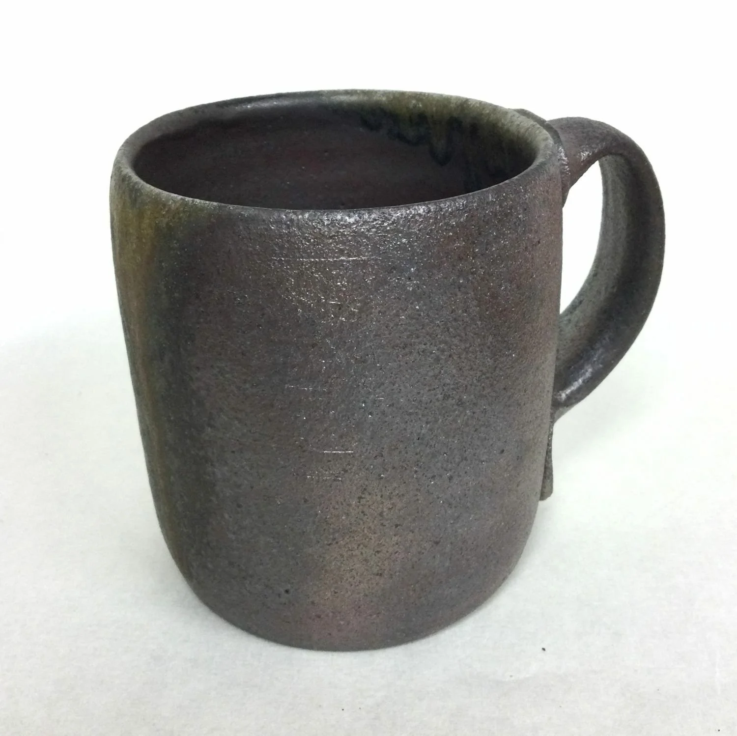 Reduction Cooled Mug (#25.2), 2025, woodfired porcelain, 4 x 3.25 x 4.75 inches (10 x 8.5 x 12 cm), sold.