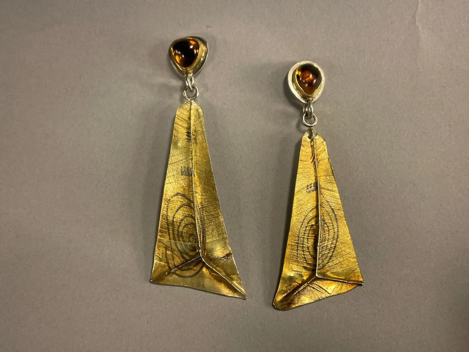 ‘Laylines’ Earrings (Swoop Series), 1993, materials 18k gold laminate, sterling, 24k Bezels, Teardrop & Trillion Citrines, each (6.5x2.5x1.5cm), $1000 Cdn.