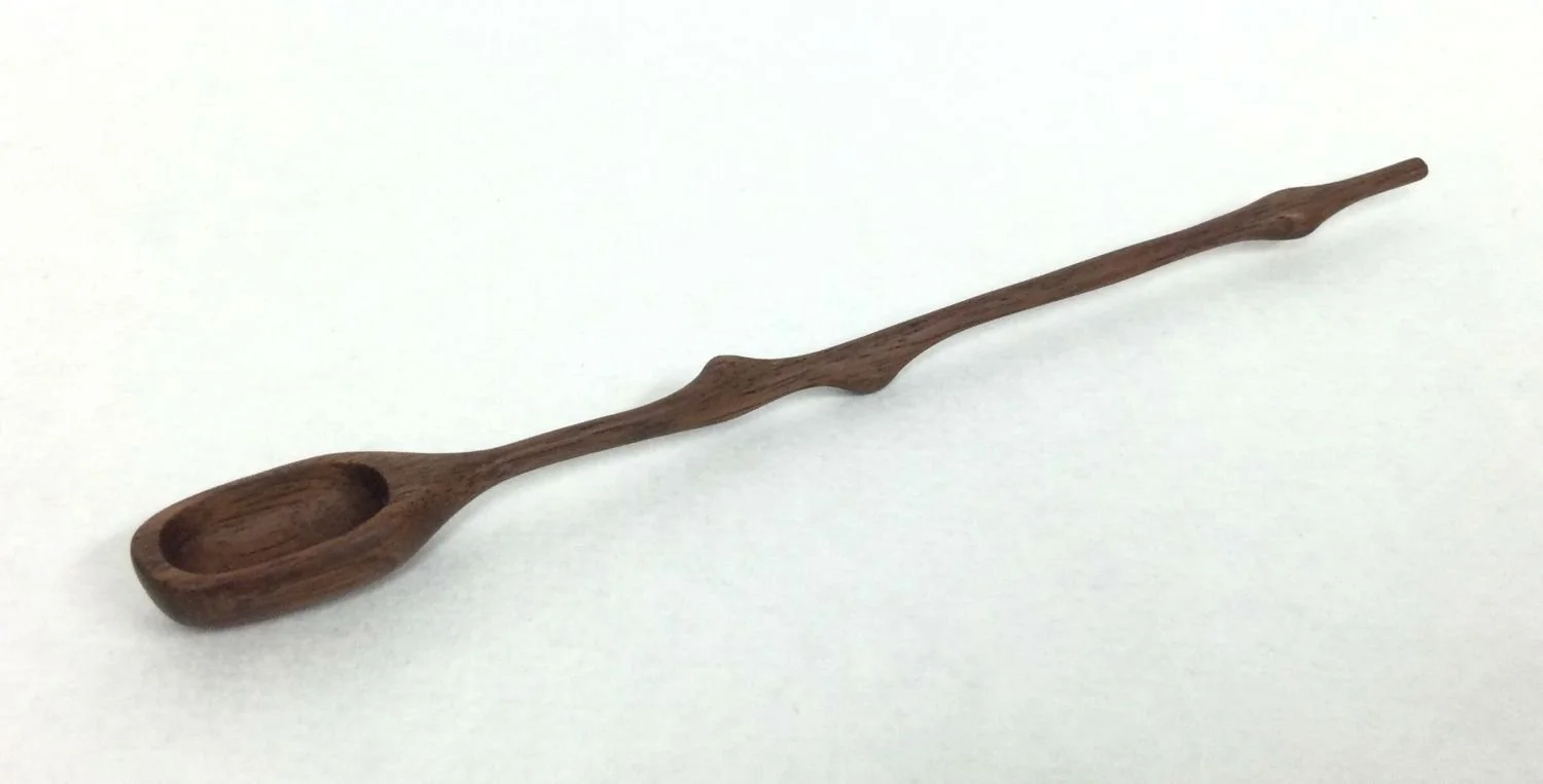 Mountain Cascade Small Spoon (#25.12.16), 2025, hand carved & sanded walnut, 6 x .5 x .25 inches (15 x 1.5 x .5 cm), $24.95 Cdn.