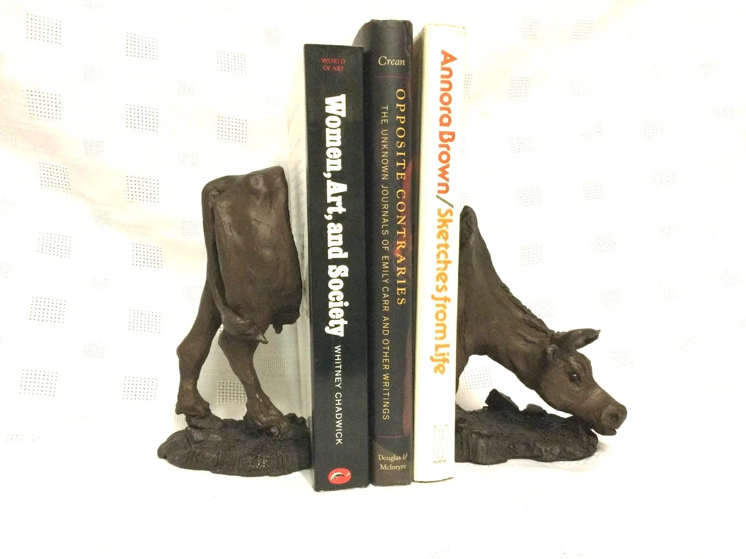 How Now Light Brown Cow Bookends (brown), bronze, edition 4/5, 6 x 4 x 8 inches (15 x 10 x 20 cm), two pieces, sold.