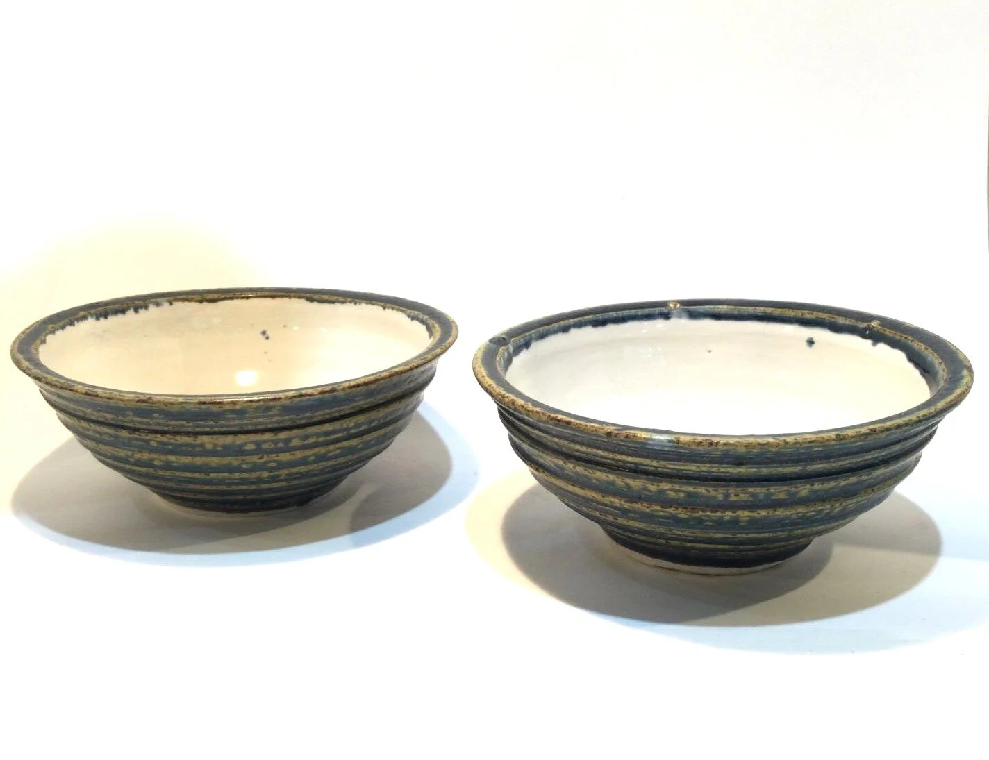 Medium Reduction Dipping Dishes (#26.6.19AB), 2026, reduction fired porcelain, 2.5 x 5.25 inches (6.5 x 13 cm), $35 Cdn each
