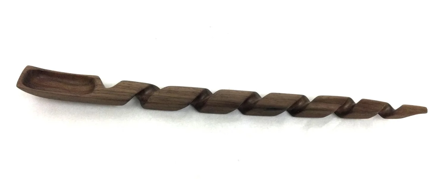 Curly Long-Handled Spoon (#25.2.13), 2025, chiselled and hand-sanded walnut, 15 x 1.25 x 1 inches (38 x 3 x 2.5 cm), $145 Cdn.