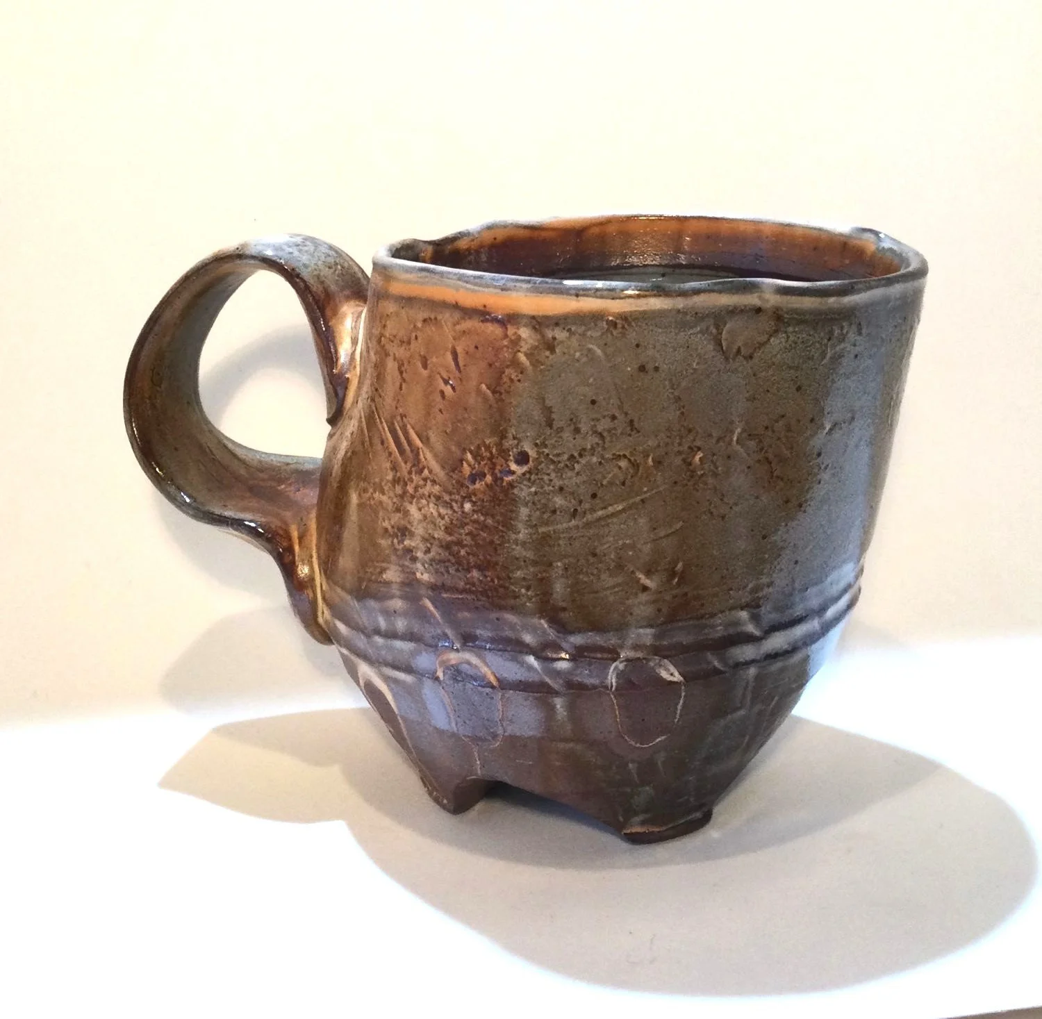 Confluence - Footed Mug (#26.2.78), 2026, low soda-fired earthenware, 3.75 x 5 x 3.5 inches (10 x 13 x 9 cm), $90 Cdn.