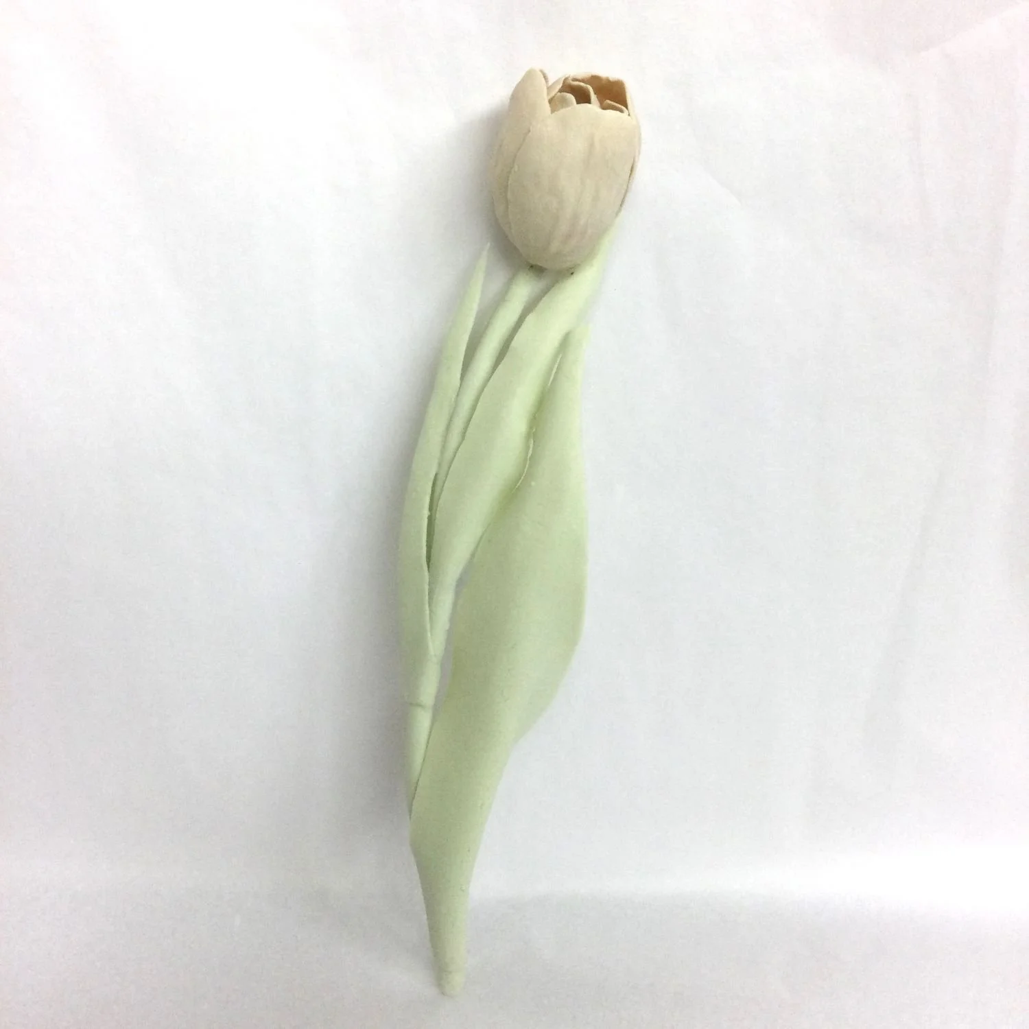 Pink Tulip (cat#21.2), 2021, cone 6 hand modelled tinted porcelain, wall mounted, 10.25 x 2.25 x 2 inches (26 x 5.5 x 5 cm), $700 Cdn.