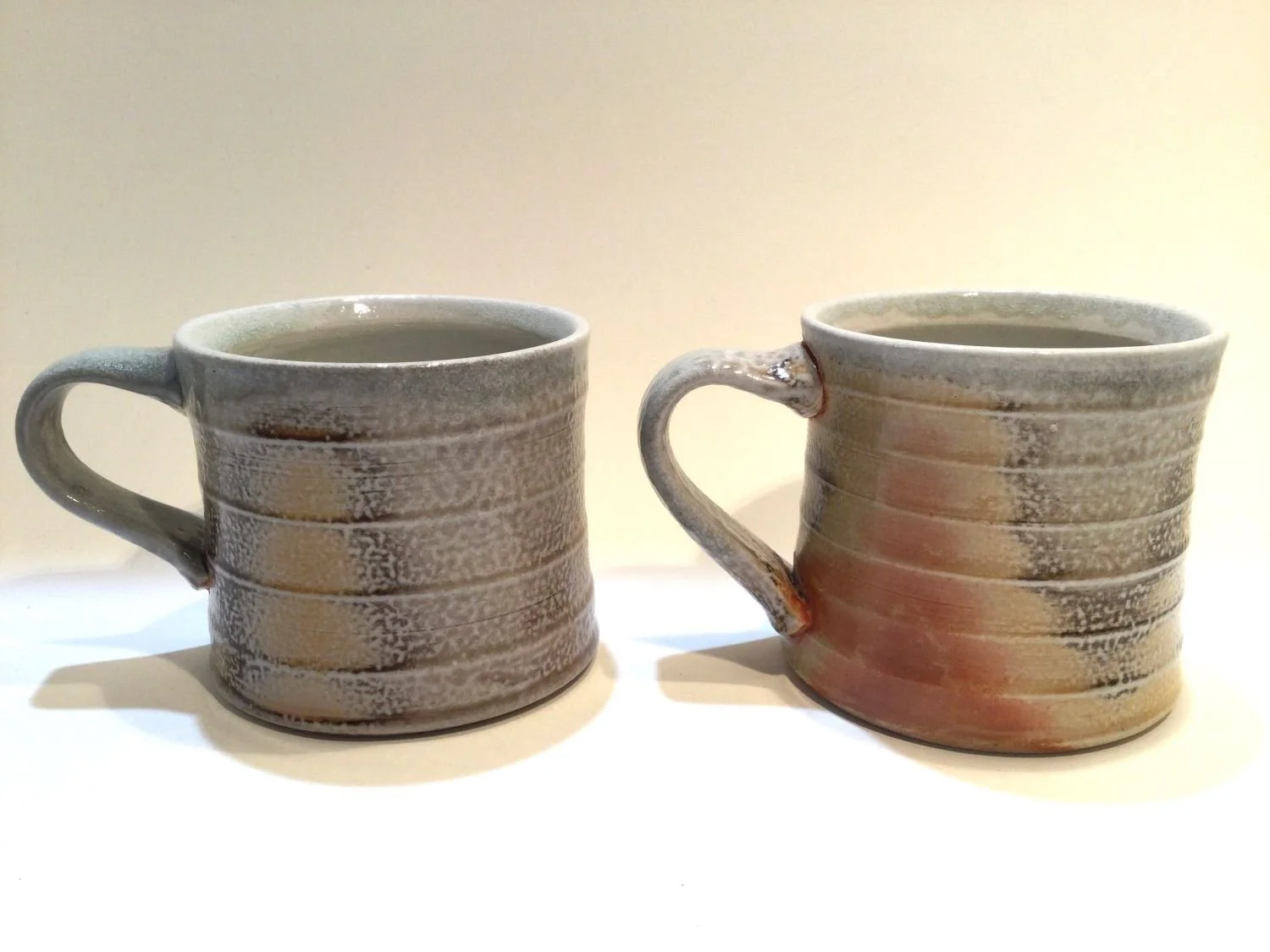 Espresso Mugs (#26.7.2ac), 2026, soda fired porcelain, 3 x 4.5 x 3.25 inches (7.5 x 11 x 8 cm), $45 Cdn each