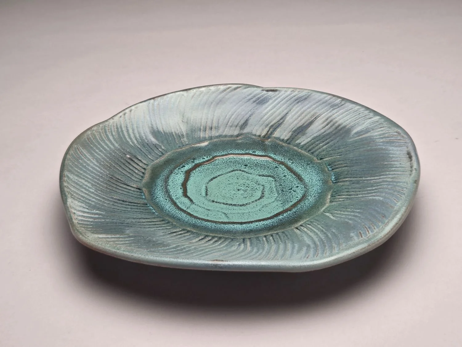 Whirlpool & Blue Sky Plate (#26.5.9b), 2026, glazed stoneware, 1.25 x 9 x 9 inches (3 x 23 x 23 cm), $110 Cdn.