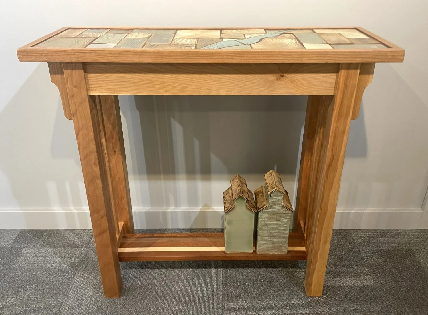 Prairie River & Grain Elevators Hall Table (#26.5.21), 2026, handbuilt cherry, carved and glazed tile top, 31.25 x 11.5 x 34 inches (79 x 29 x 86 cm), $2800 Cdn.