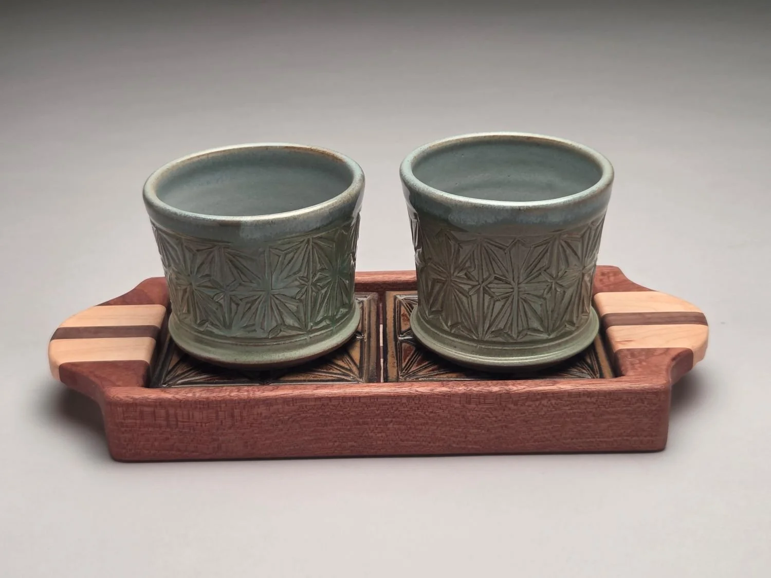 Kumiko Blue Skies Whiskey Cups, Coasters & Tray Set (#26.5.17), 2026, hand carved, glazed stoneware, handcrafted wood (2 cup, tray, coasters), 4.25 x 5 x 11.5 inches (10.5 x 12.5 x 29  cm), $195 Cdn.