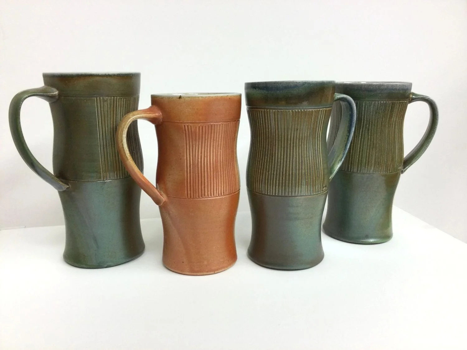 Tall Striped Mugs (#26.7.1il), 2026, soda fired porcelain, c.7 x 4.5 x 3.5 inches (18x11x8.5 cm), $55 Cdn each (I, L with J & K sold)