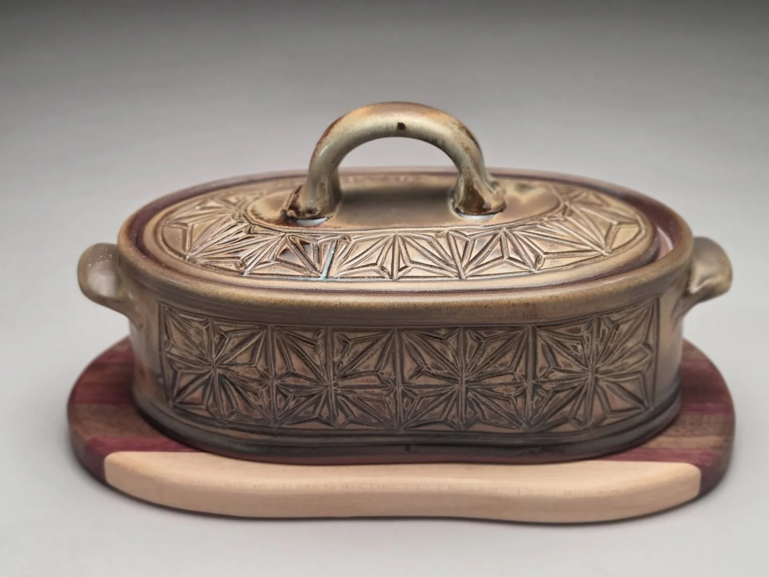 Kumiko Blue Skies & Prairie Fields Casserole with Wood Trivet (med #26.5.13ba), 2026, hand carved & glazed stoneware, handcrafted wood, 6 x 6.5 x 11.5 inches (15 x 16.5 x 29  cm), $275 Cdn.