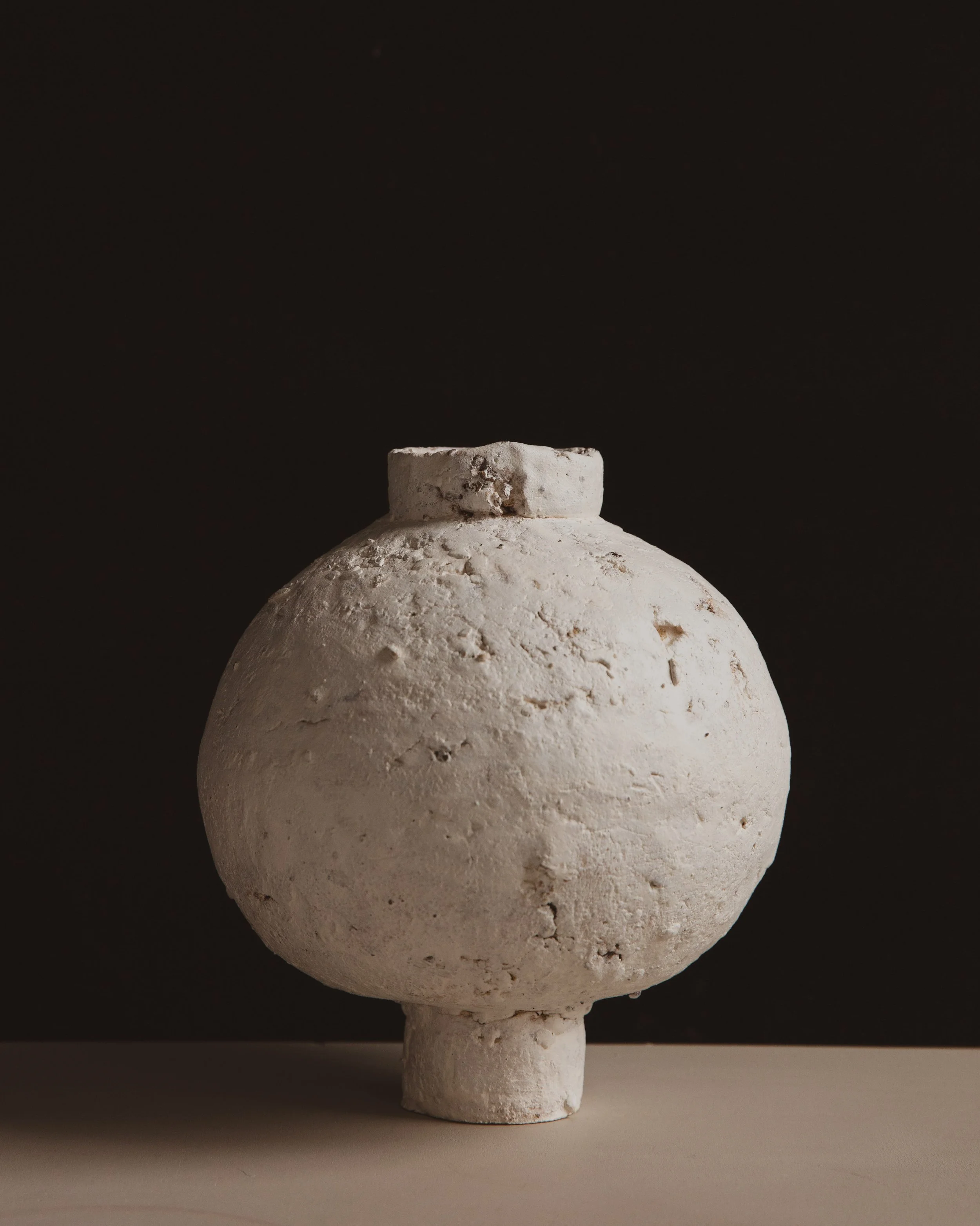 Handmade ceramic moon jar with textured white clay surface