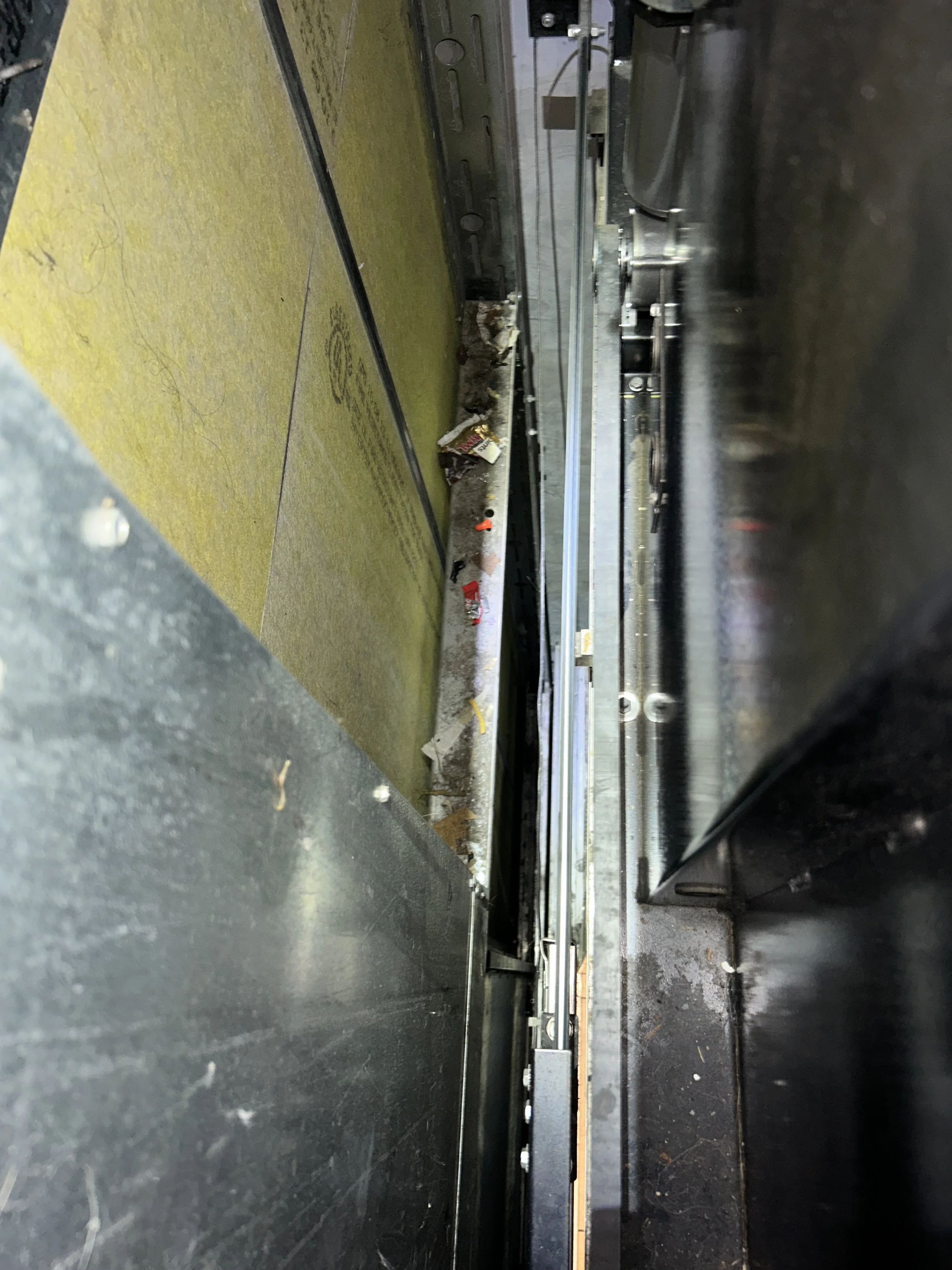 Dust and debris buildup in elevator hoistway