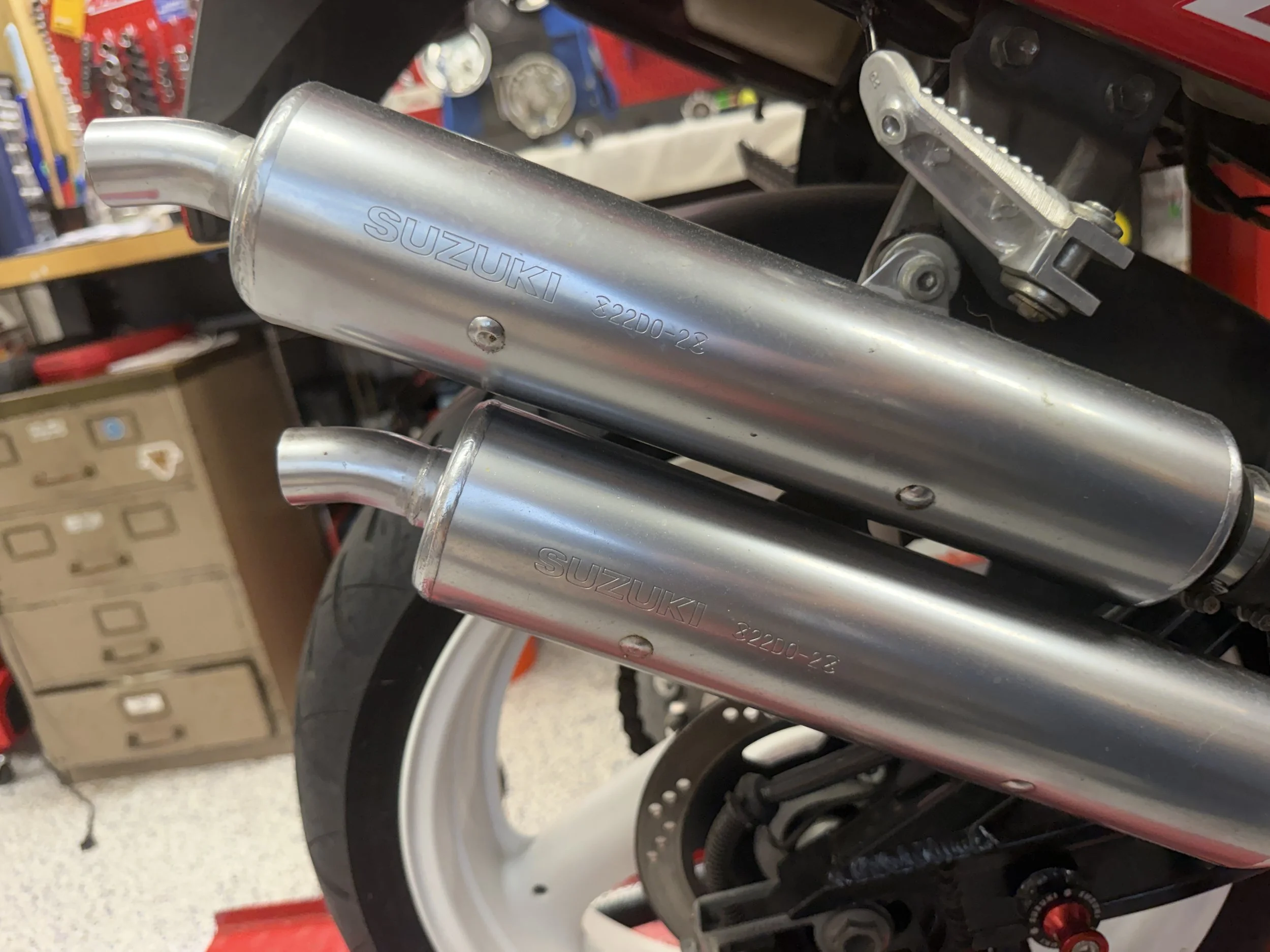 Beautiful OEM pipes....are they restricted though....and if so....how?