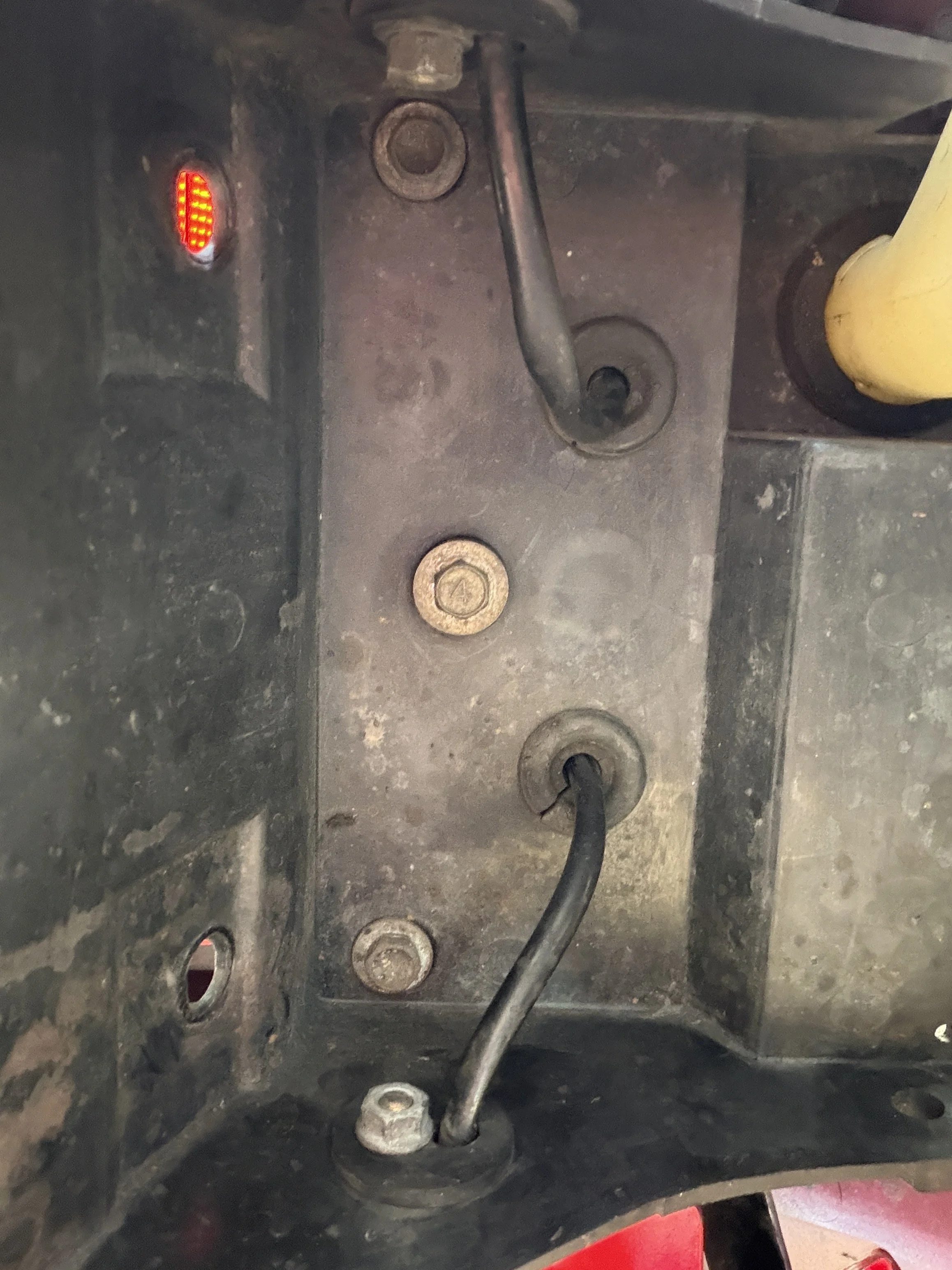 ...and then undo this 10mm reached from under the fender/mudguard...
