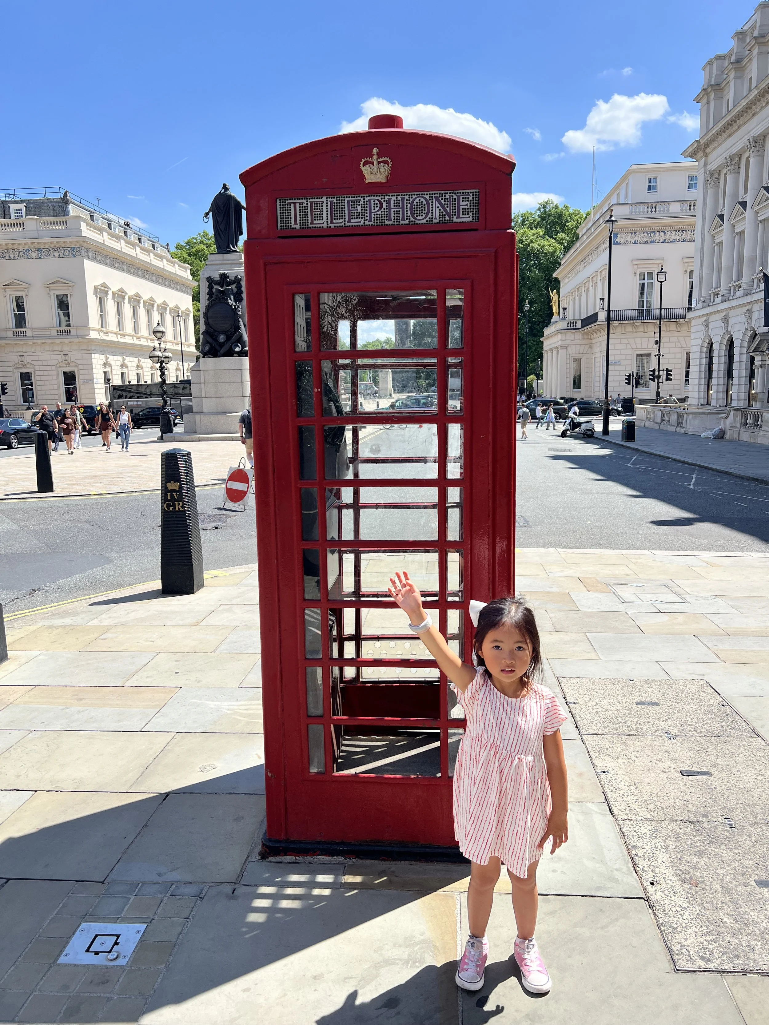 Posing with telephone booth